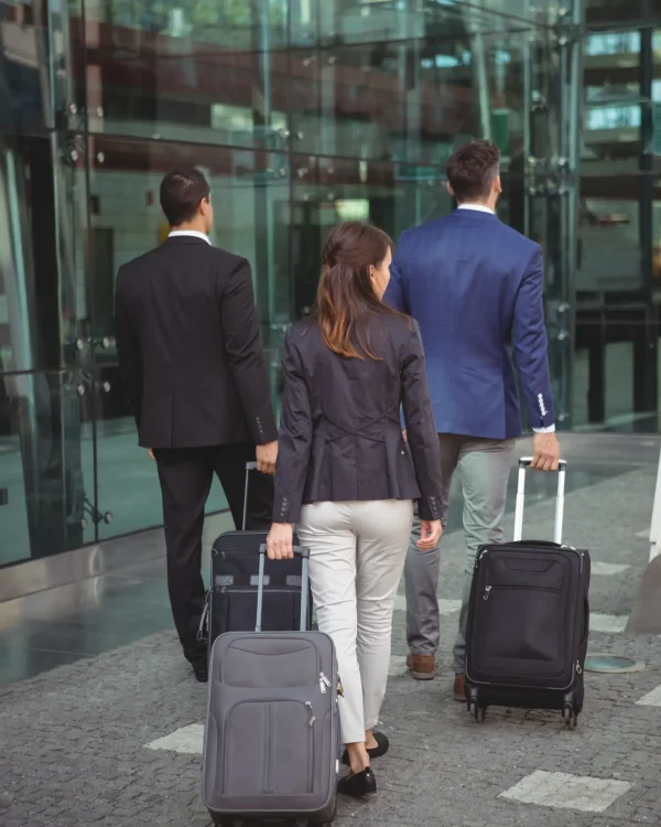business-people-with-luggage-walking-to-office-2026-01-09-08-36-21-utc