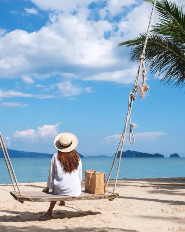 rear-view-image-of-a-young-woman-sitting-on-wooden-2026-03-15-23-49-49-utc